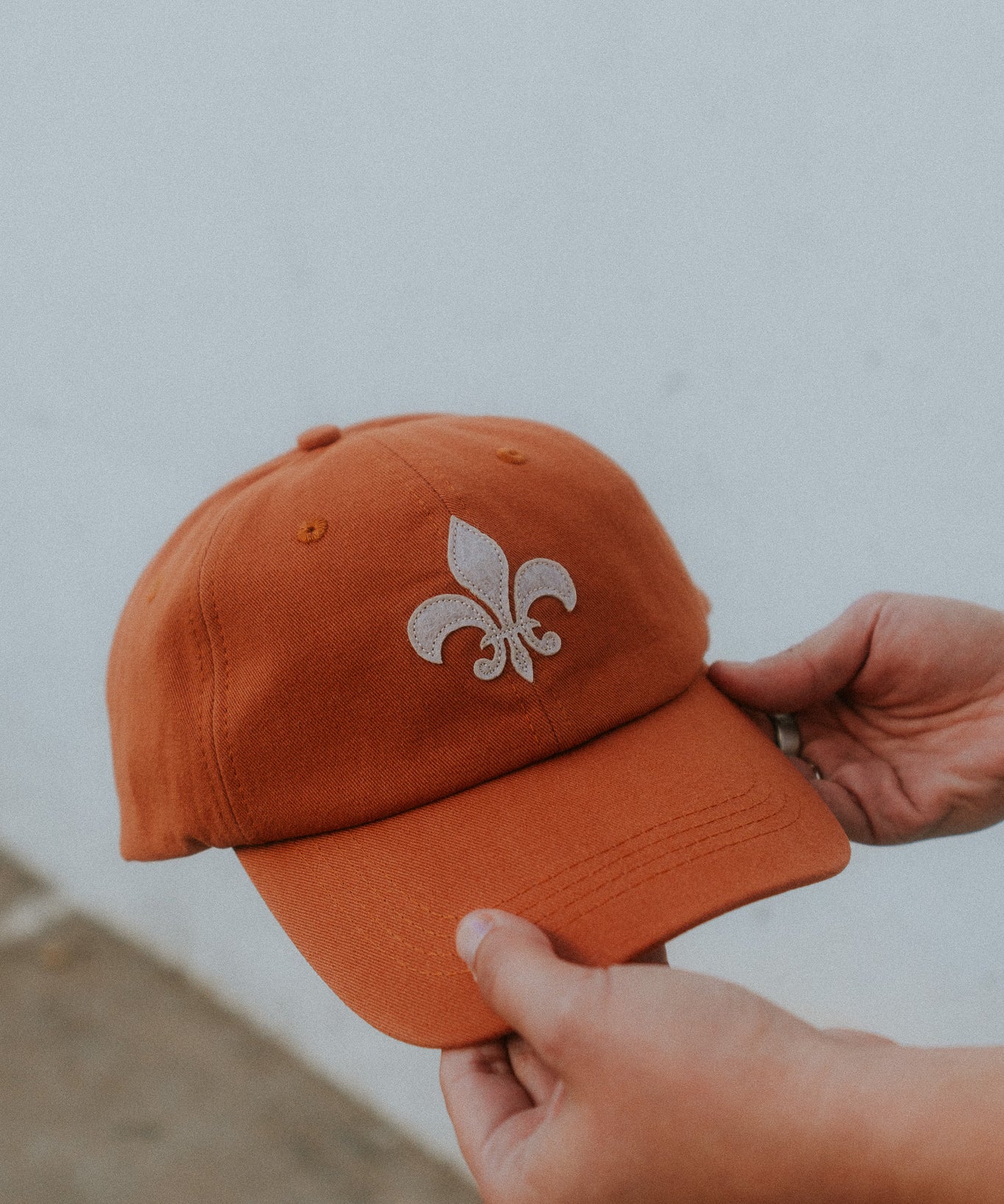 Pastel orange organic cotton fleur-de-lis felt patch hat by JON BLANCO