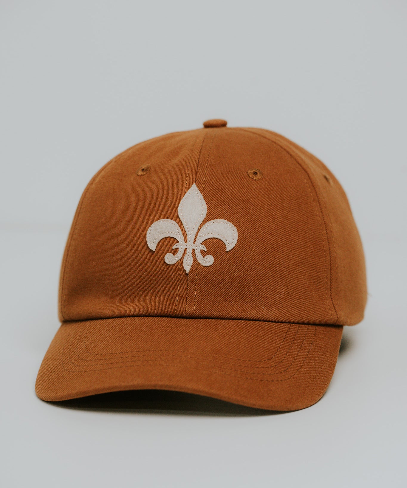 Camel organic cotton fleur-de-lis felt patch hat, mid profile, by JON BLANCO