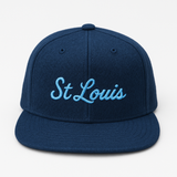 Navy blue cap with 'St Louis' embroidered in light blue on a white background